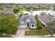 Charming home with well-maintained lawn and lovely water view, perfect for serene living at 10414 Andover Point Cir, Orlando, FL 32825