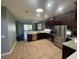 Open kitchen with stainless appliances, granite counters, and ample cabinet space at 10414 Andover Point Cir, Orlando, FL 32825