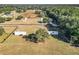 Spacious property featuring fenced pastures, mature trees, and cozy single Gathering homes at 1072 Se 155Th St, Summerfield, FL 34491