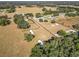 Expansive parcel featuring fenced pastures, mature trees, and cozy single Gathering homes at 1072 Se 155Th St, Summerfield, FL 34491