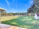 Expansive backyard with lush green grass and mature trees, perfect for outdoor activities at 1072 Se 155Th St, Summerfield, FL 34491