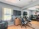 Cozy bedroom featuring a window, closet mirror, dresser, and desk area, perfect for relaxing or studying at 1072 Se 155Th St, Summerfield, FL 34491