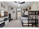 Cozy bedroom with bunk beds, neutral colors, ceiling fan, and a window with natural light at 11407 Wakeworth St, Orlando, FL 32836