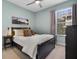 Inviting bedroom with queen-sized bed, comfortable furnishings, and soft, natural lighting at 11407 Wakeworth St, Orlando, FL 32836