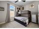 Bright bedroom featuring bunk beds, ceiling fan, window, and neutral colored walls and carpet at 11407 Wakeworth St, Orlando, FL 32836