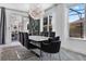 Elegant dining area with a large table, stylish chairs, and views of the outdoors at 11407 Wakeworth St, Orlando, FL 32836
