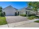 Charming home with a brick driveway and a welcoming front porch, exuding curb appeal at 11407 Wakeworth St, Orlando, FL 32836