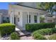 Welcoming front porch with classic white columns and meticulous landscaping, creating a charming entrance at 11407 Wakeworth St, Orlando, FL 32836