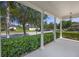 Open front porch with view of landscaped yard at 11407 Wakeworth St, Orlando, FL 32836