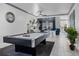 Spacious game room with a pool table, stylish decor, and neutral color palette at 11407 Wakeworth St, Orlando, FL 32836