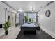 Spacious game room with a pool table, stylish decor, and neutral color palette at 11407 Wakeworth St, Orlando, FL 32836