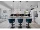 Beautiful kitchen with pendant lighting, an island with seating, and a modern backsplash at 11407 Wakeworth St, Orlando, FL 32836