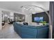 Open-concept living area with stylish decor, comfortable seating, and a view into the game room at 11407 Wakeworth St, Orlando, FL 32836