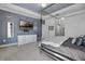 Comfortable main bedroom with a TV, dresser, and modern decor for a relaxing retreat at 11407 Wakeworth St, Orlando, FL 32836