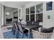 Relaxing outdoor patio with dining table, comfortable seating, and access to an indoor dining room at 11407 Wakeworth St, Orlando, FL 32836
