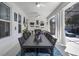 Inviting outdoor patio with dining area, fireplace, comfortable seating, and stylish decor at 11407 Wakeworth St, Orlando, FL 32836