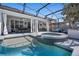 Enjoy this screened-in pool with a jacuzzi and covered patio at 11407 Wakeworth St, Orlando, FL 32836