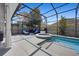 Relax with a private, screened-in pool, jacuzzi, and patio at 11407 Wakeworth St, Orlando, FL 32836
