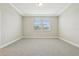 Well-lit bedroom featuring neutral walls, carpet flooring, recessed ceiling, and double windows at 11941 Bracco St, Winter Garden, FL 34787