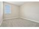 Bright bedroom with neutral walls and carpet flooring with a window at 11941 Bracco St, Winter Garden, FL 34787