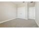 Carpeted bedroom featuring neutral walls and doors to adjacent rooms and closet at 11941 Bracco St, Winter Garden, FL 34787