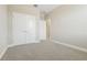 Carpeted bedroom featuring neutral walls and doors to adjacent rooms and a double door closet at 11941 Bracco St, Winter Garden, FL 34787