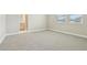 A bright bedroom with plush carpet flooring, neutral-toned walls, and natural light streaming in at 11941 Bracco St, Winter Garden, FL 34787