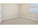 Carpeted bedroom with neutral walls and window at 11941 Bracco St, Winter Garden, FL 34787