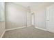 Cozy carpeted bedroom featuring neutral walls and doors to adjacent rooms at 11941 Bracco St, Winter Garden, FL 34787