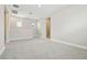 Spacious living room featuring neutral tones, carpet flooring, and plenty of natural light at 11941 Bracco St, Winter Garden, FL 34787
