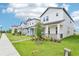 A row of inviting two-story homes, each featuring a well-kept lawn and charming landscaping at 11941 Bracco St, Winter Garden, FL 34787