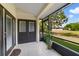 Enclosed lanai with tiled floors, a view of the backyard, and access to the interior at 12133 Augusta Woods Cir, Orlando, FL 32824