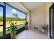 Screened-in lanai with tile floor and views of a lush green landscape at 12133 Augusta Woods Cir, Orlando, FL 32824
