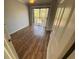 Bedroom featuring wood-look flooring and sliding glass doors to a balcony at 122 Water Front Way # 360, Altamonte Springs, FL 32701