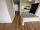 Galley-style kitchen with white cabinets and granite breakfast bar at 122 Water Front Way # 360, Altamonte Springs, FL 32701
