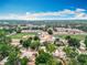 Aerial shot featuring a residential neighborhood and nearby athletic fields and schools at 130 Aragon Ave, Umatilla, FL 32784