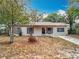 Charming single-story home featuring a well-maintained front yard and cozy curb appeal at 130 Aragon Ave, Umatilla, FL 32784