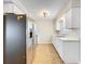 Modern kitchen with stainless steel appliances, white cabinetry, and stylish countertops at 130 Aragon Ave, Umatilla, FL 32784