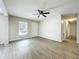 Open living room with neutral paint, modern floors and ample natural light at 130 Aragon Ave, Umatilla, FL 32784