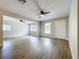 Sunlit living room with modern floors, neutral paint and an inviting atmosphere at 130 Aragon Ave, Umatilla, FL 32784