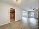 Open-concept living room with hardwood flooring and plenty of natural light at 130 Aragon Ave, Umatilla, FL 32784