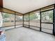 A covered patio with aluminum screening offering a great outdoor retreat at 130 Aragon Ave, Umatilla, FL 32784