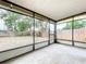 A covered patio with aluminum screening offering a great outdoor retreat at 130 Aragon Ave, Umatilla, FL 32784