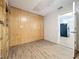 A secondary room featuring custom wood paneling and built-in storage at 130 Aragon Ave, Umatilla, FL 32784