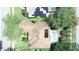 Overhead aerial view of a home featuring a screened pool and solar panels at 13250 Meergate Cir, Orlando, FL 32837