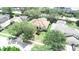 Aerial view of home showcasing the well-manicured lawn and landscaping at 13250 Meergate Cir, Orlando, FL 32837