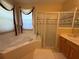 Bright bathroom with soaking tub and glass enclosed shower at 13250 Meergate Cir, Orlando, FL 32837