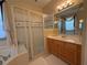 Bright bathroom featuring soaking tub and enclosed shower at 13250 Meergate Cir, Orlando, FL 32837