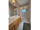 Bathroom featuring a double sink vanity, tile flooring, and shower/tub combo at 13250 Meergate Cir, Orlando, FL 32837