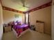 This bedroom features bright and colorful design with plush furnishings, and soft lighting at 13250 Meergate Cir, Orlando, FL 32837